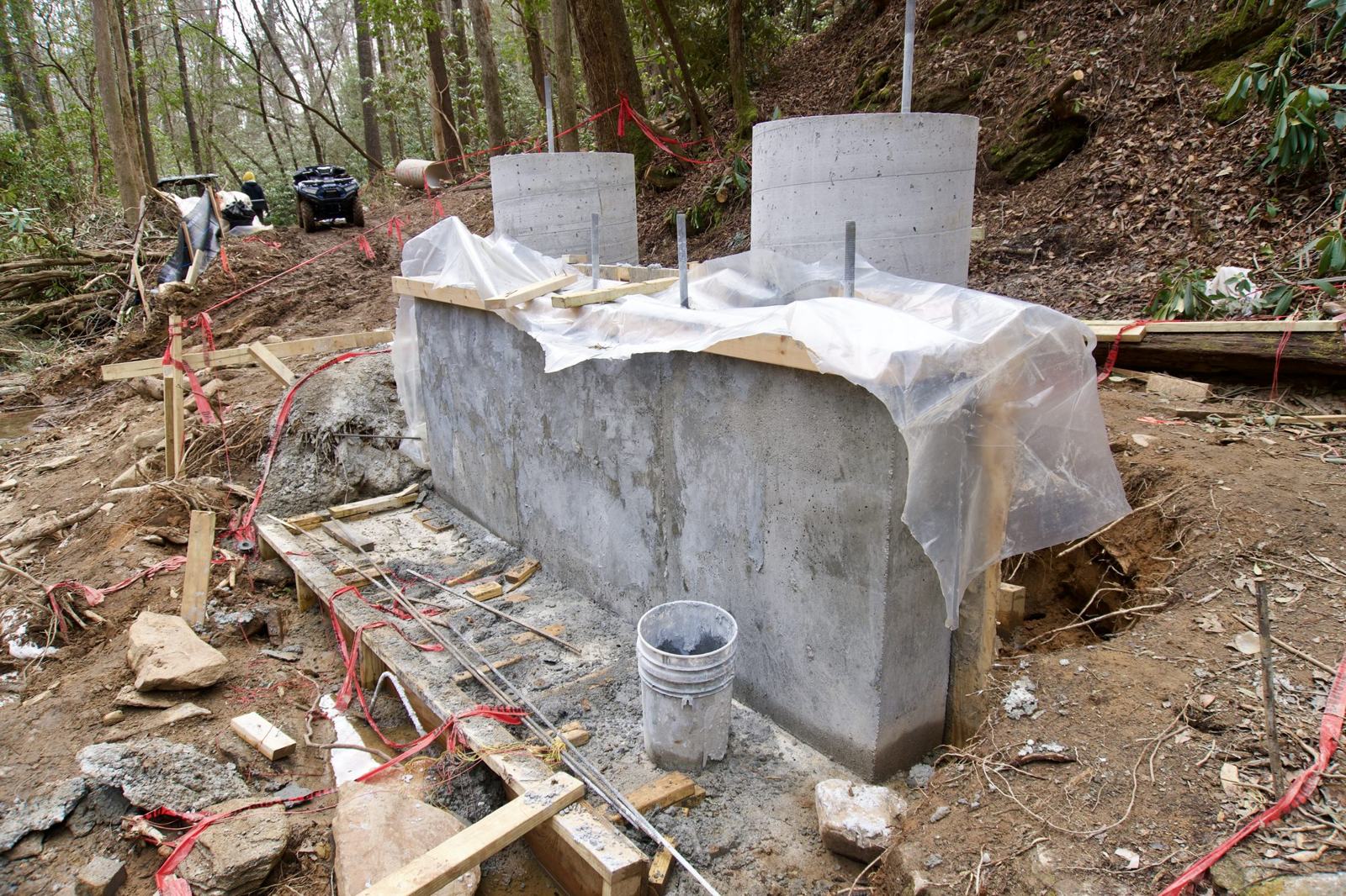 Concrete abutment wall with pier columns at a remote bridge site